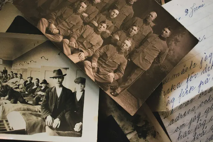 An old photo of a group of people on a table